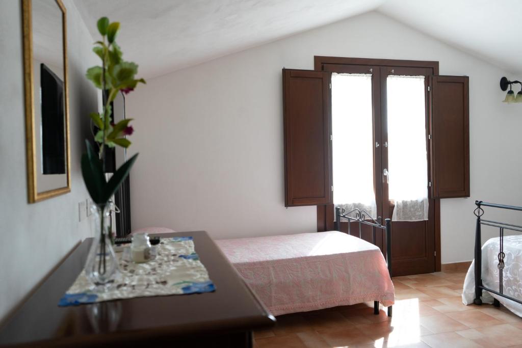 A bed or beds in a room at B&B 4 Stagioni