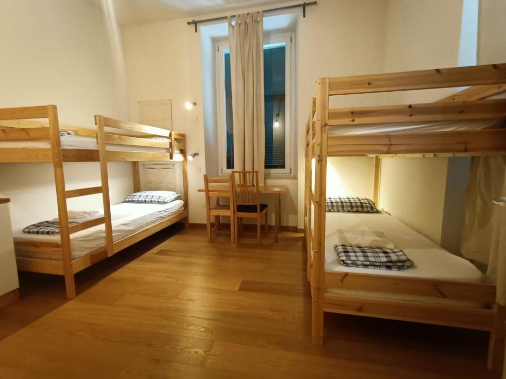 Łóżko lub łóżka w pokoju w obiekcie Panperduto