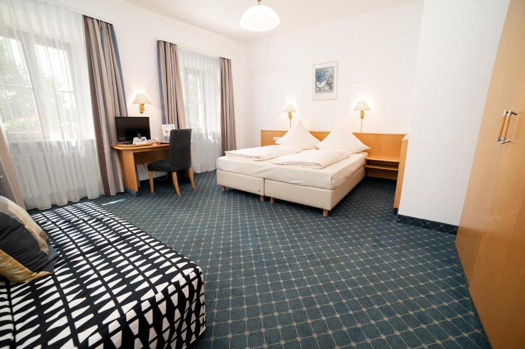 Postel nebo postele na pokoji v ubytování Akzent Hotel Schranne