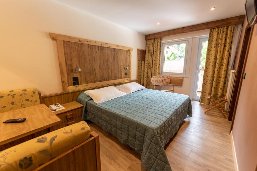 Postel nebo postele na pokoji v ubytování Hotel Pangrazzi - 3 stelle superior