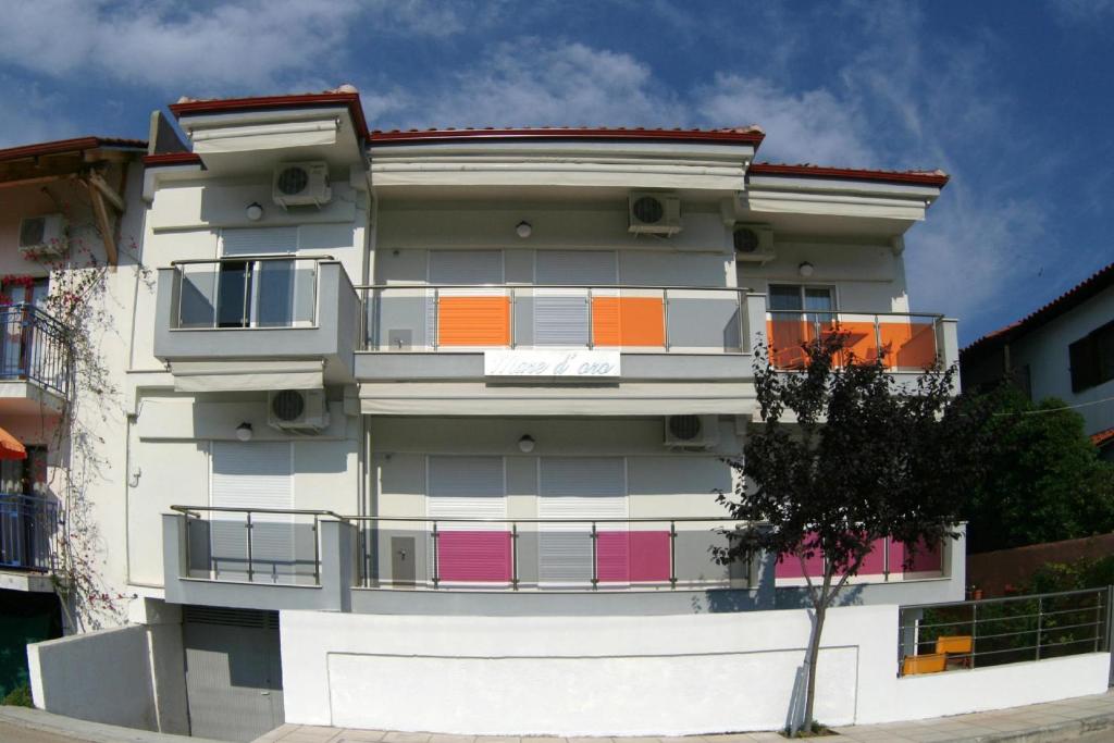a building with colorful windows on the side of it at Mare D'Oro in Sarti