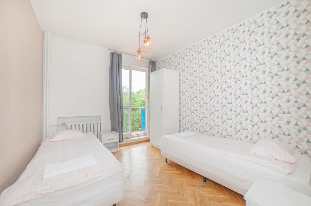 Posteľ alebo postele v izbe v ubytovaní Tatamka Hostel