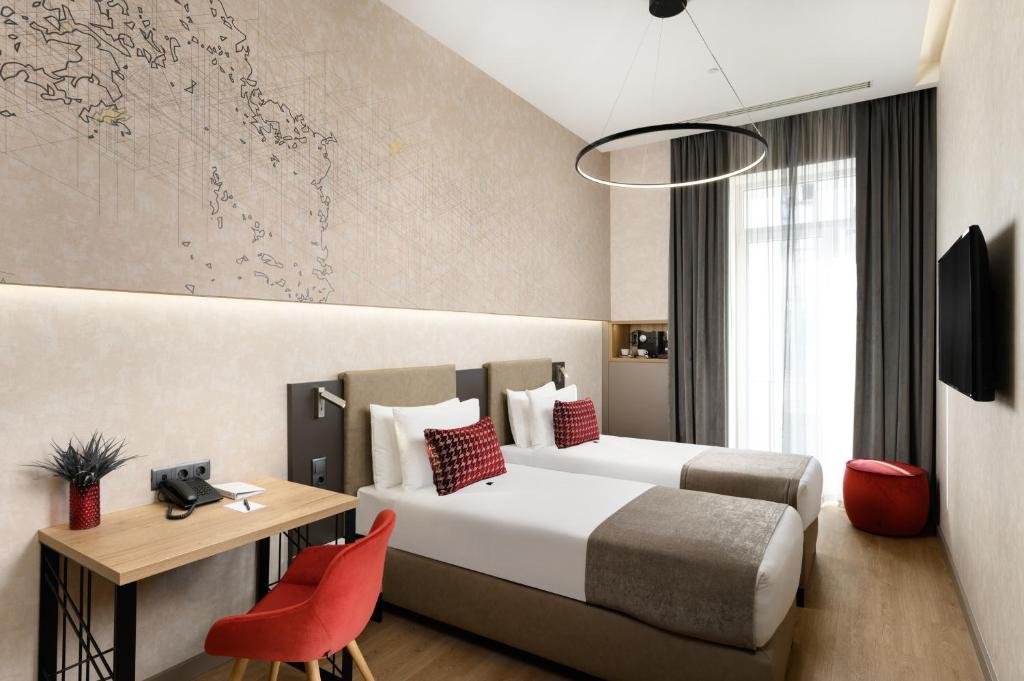 a hotel room with a bed and a desk and a chair at Hotel Vision Budapest by Continental Group in Budapest