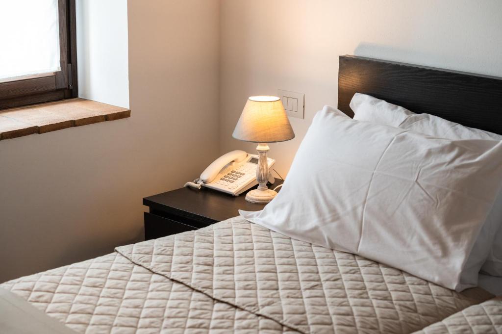 Posteľ alebo postele v izbe v ubytovaní Al Pompiere - Wine and rooms