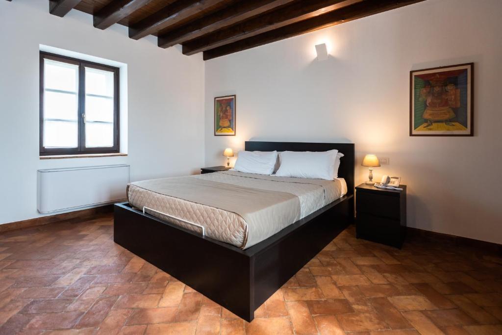 Posteľ alebo postele v izbe v ubytovaní Al Pompiere - Wine and rooms