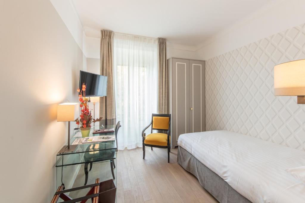 Postel nebo postele na pokoji v ubytování Hotel Victoria