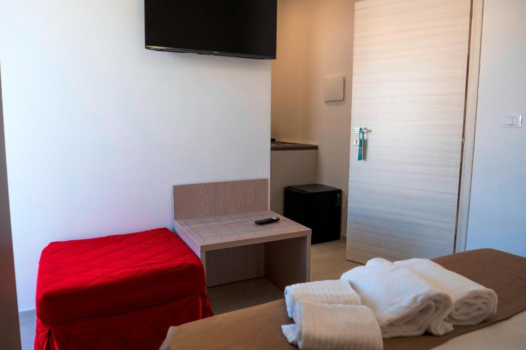 TV a/nebo společenská místnost v ubytování B&B A Un Passo dal Mare