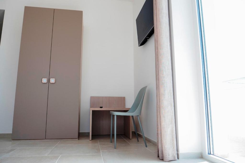 TV a/nebo společenská místnost v ubytování B&B A Un Passo dal Mare