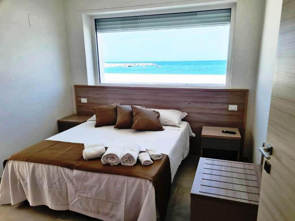 Postel nebo postele na pokoji v ubytování B&B A Un Passo dal Mare