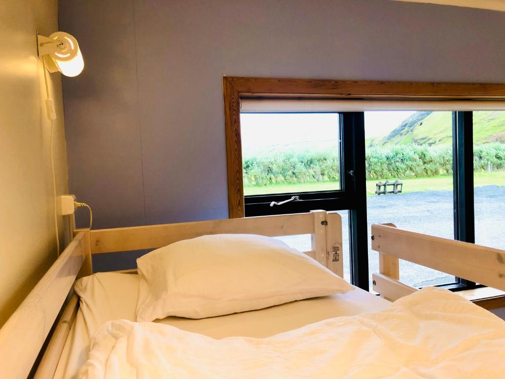 Rúm í herbergi á Paradise Cave Hostel & Guesthouse