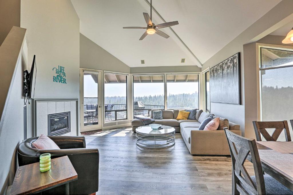a living room with a couch and a table at Gorgeous Bend Condo with Community Hot Tub! in Bend