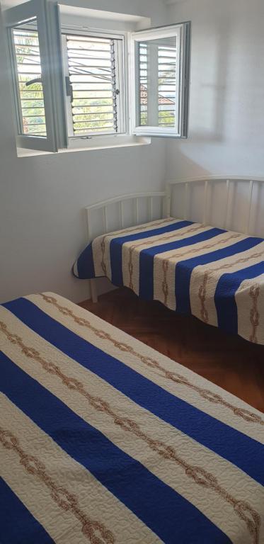 Postel nebo postele na pokoji v ubytování Apartment Sliskovic