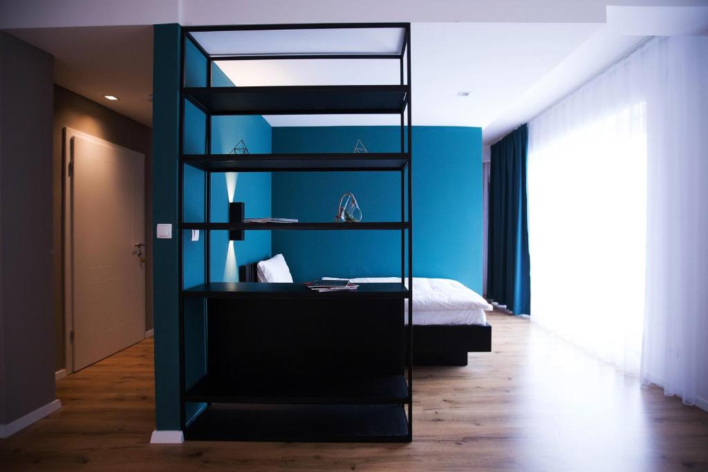 Postel nebo postele na pokoji v ubytování Swiss Apartments Prishtina