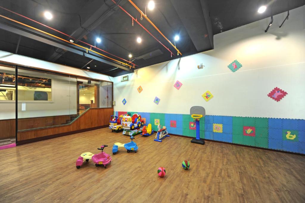 a gym with toys on the floor in a room at Kenting Holiday Hotel in Hengchun South Gate
