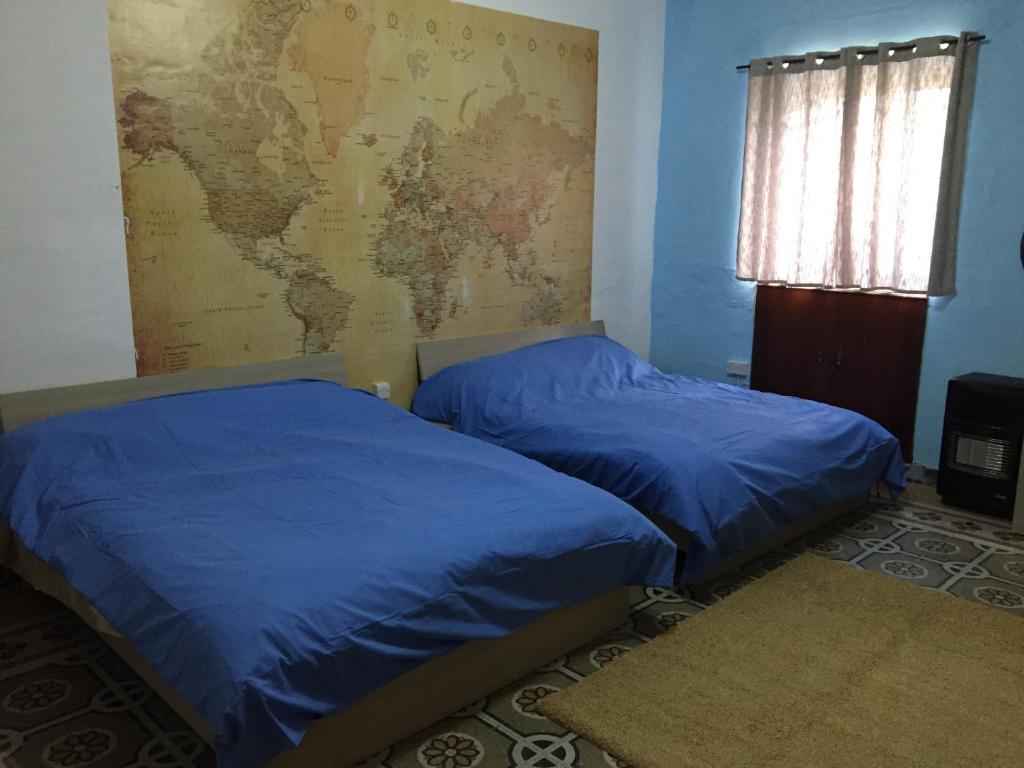 Postel nebo postele na pokoji v ubytování Sunrise Apartment