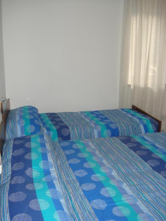 Postel nebo postele na pokoji v ubytování Albergo Larese