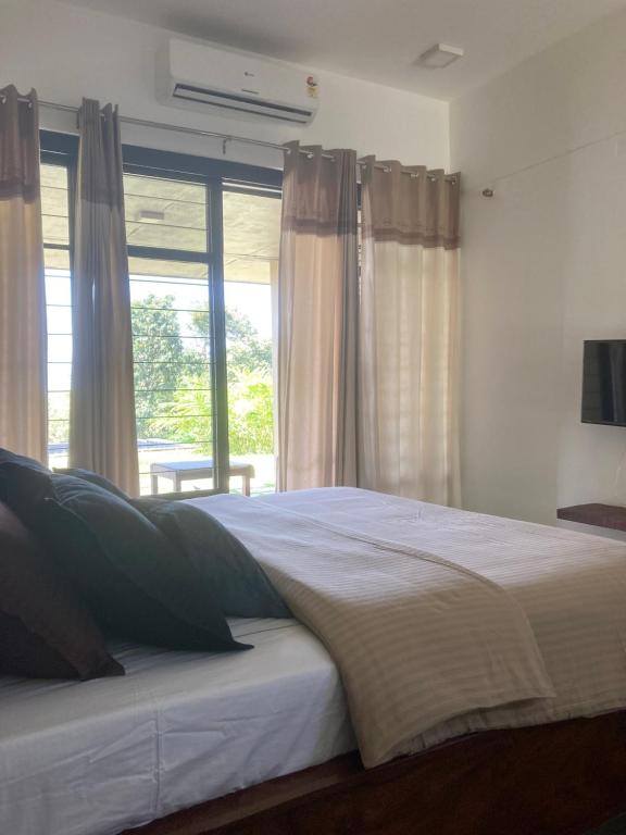 Postel nebo postele na pokoji v ubytování Homestay Namaha
