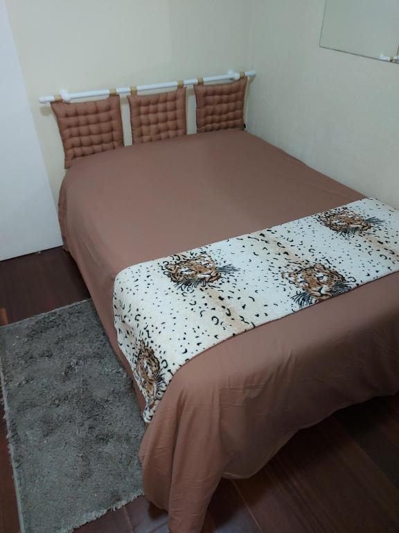 Cama o camas de una habitación en Aluguel Temporada em Gramado