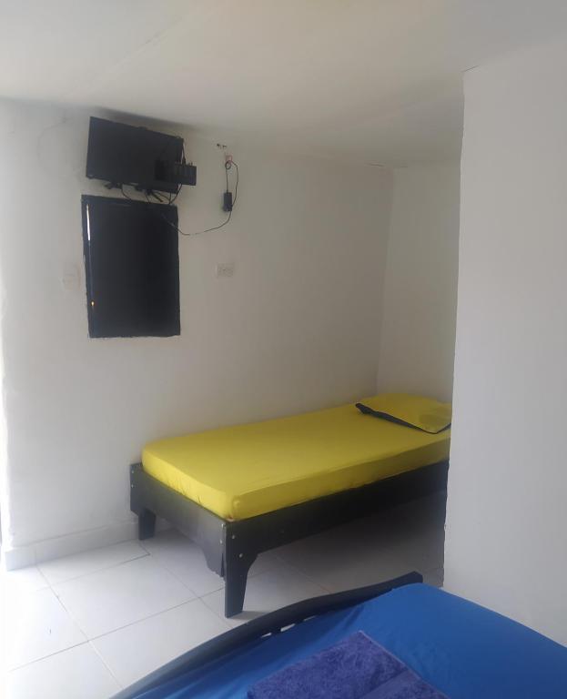 Cama o camas de una habitación en Hostal CQ Camarones