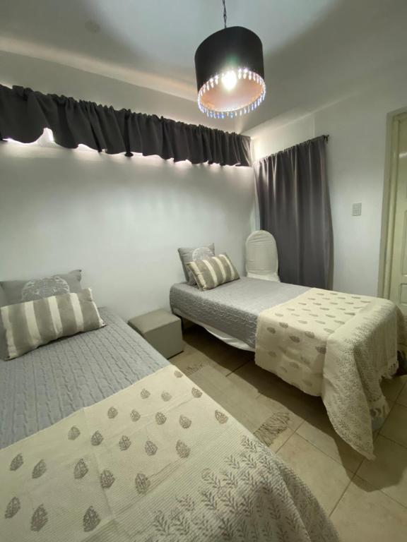 Postel nebo postele na pokoji v ubytování Hostal Alto Ayre Salta