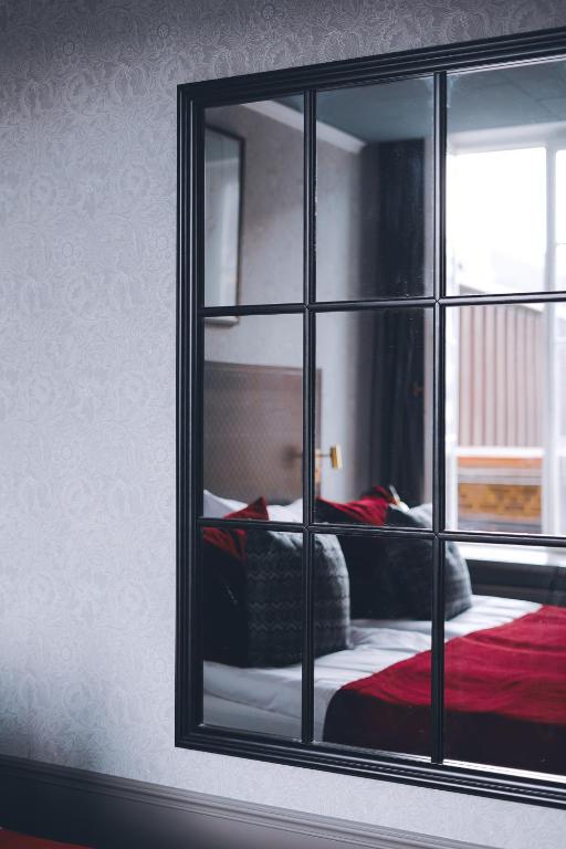 Postel nebo postele na pokoji v ubytování Home Hotel Grand Helsingborg