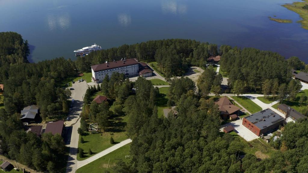 an aerial view of a building on the shore of a lake at Park Hotel Burduguz in Burduguz