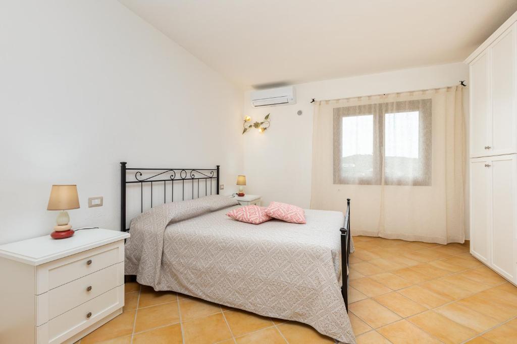 Postel nebo postele na pokoji v ubytování Villa Tomaso