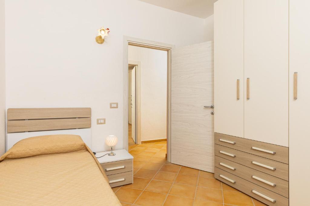 Postel nebo postele na pokoji v ubytování Villa Tomaso