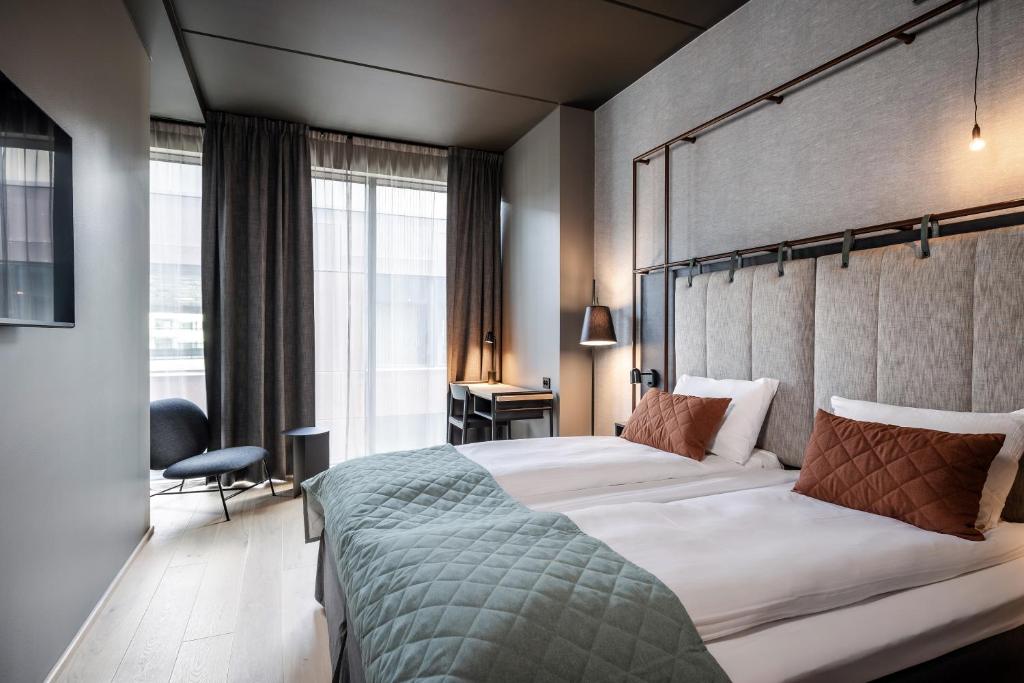 Postel nebo postele na pokoji v ubytování Quality Hotel Hasle Linie