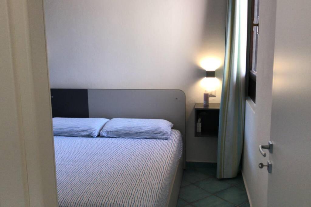 Кровать или кровати в номере Pelosa - Capo Falcone Excellent Apartment