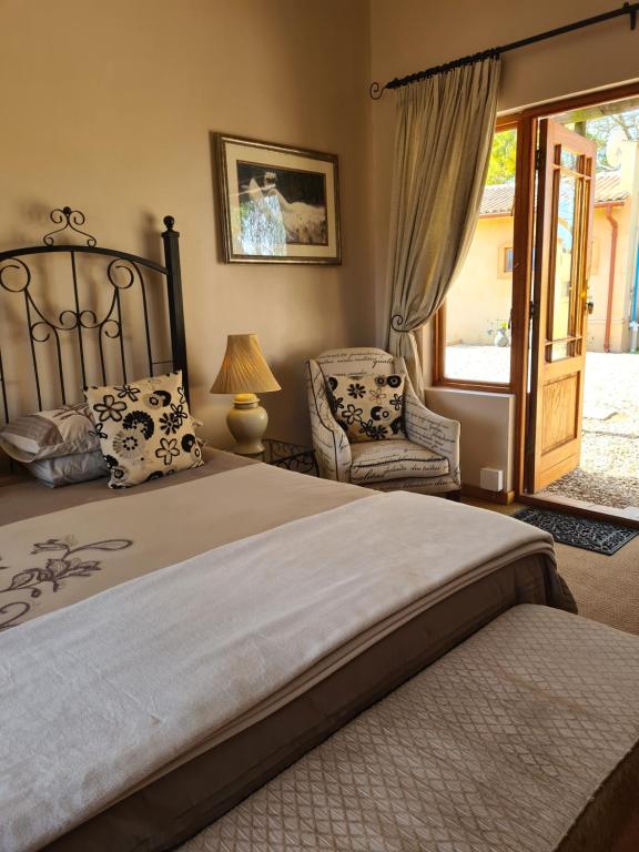 Een bed of bedden in een kamer bij Casa Mia Health Spa and Guesthouse