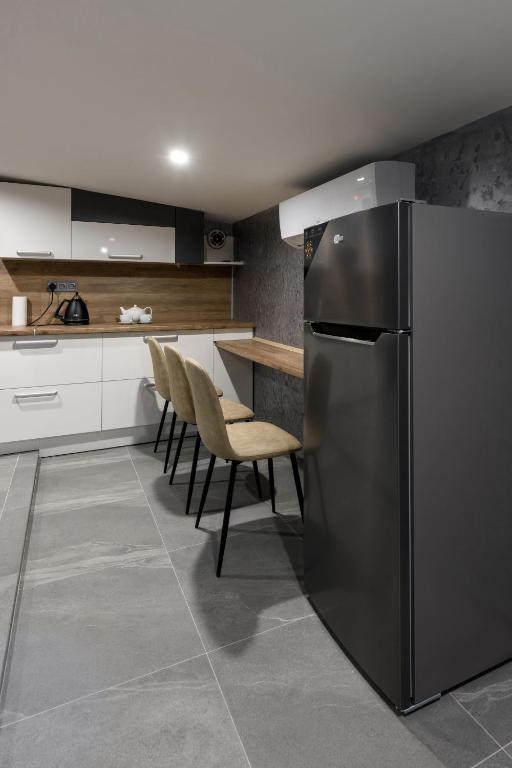 Kuchyň nebo kuchyňský kout v ubytování Apart Hotel Fusion