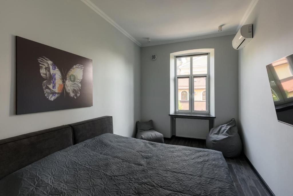 Postel nebo postele na pokoji v ubytování Apart Hotel Fusion
