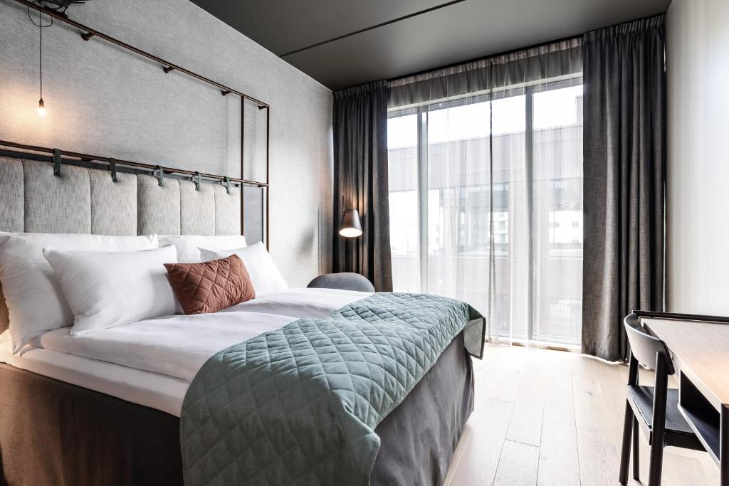 Postel nebo postele na pokoji v ubytování Quality Hotel Hasle Linie