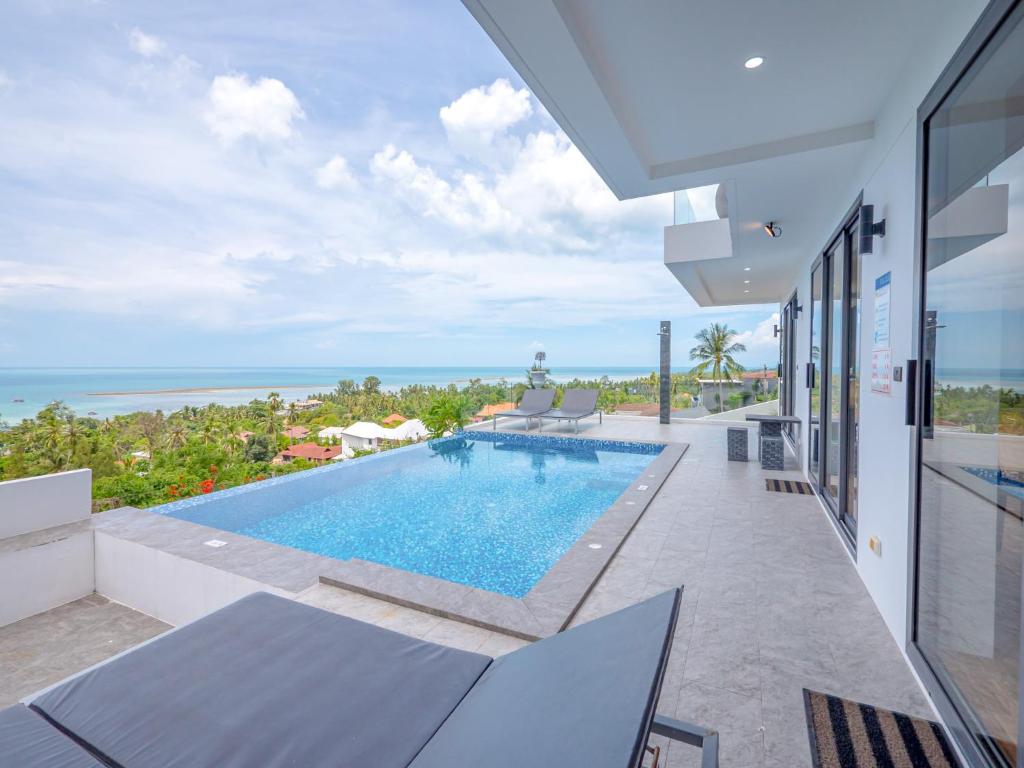 a view of a swimming pool in a house at Villas Reef View Garden in Koh Samui