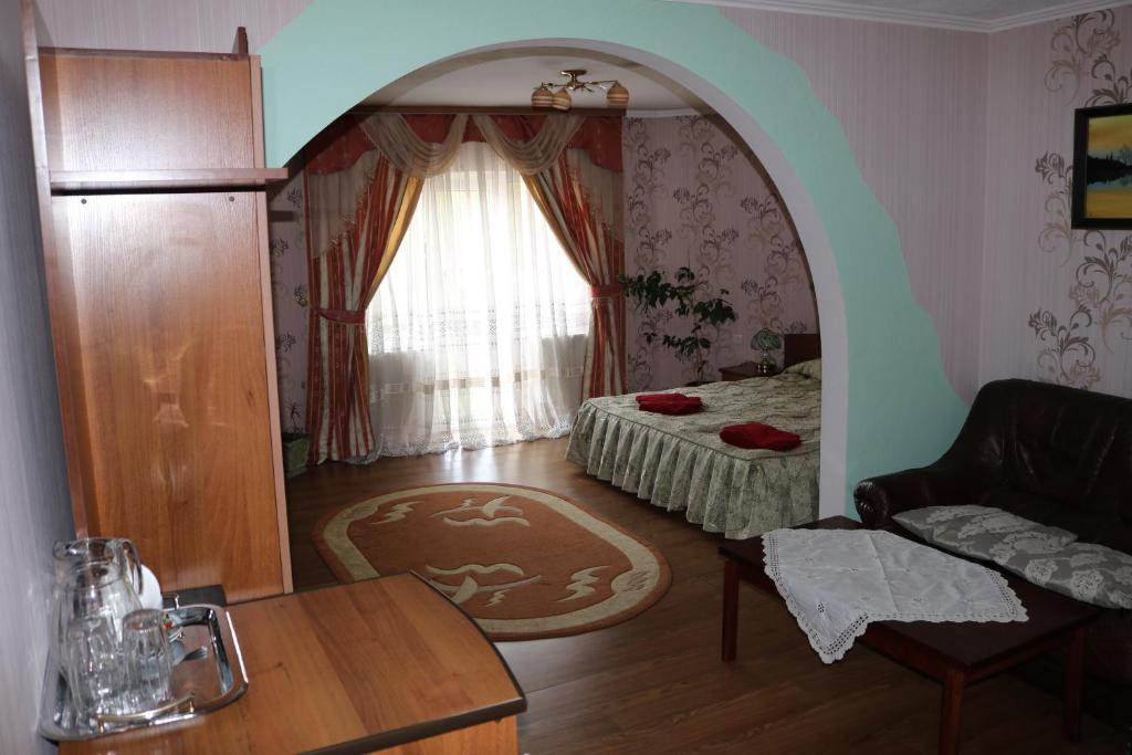 Postel nebo postele na pokoji v ubytování Готель ***ФЕЄРІЯ