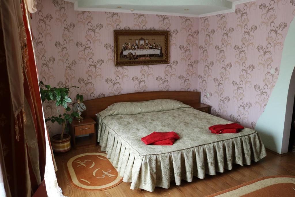 Postel nebo postele na pokoji v ubytování Готель ***ФЕЄРІЯ