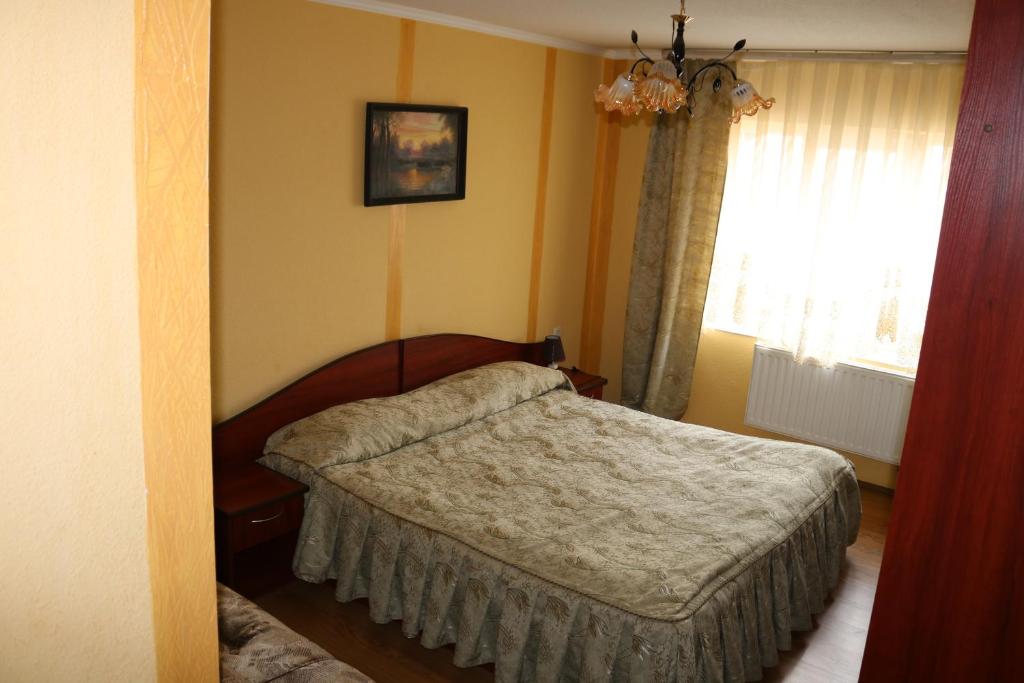Postel nebo postele na pokoji v ubytování Готель ***ФЕЄРІЯ