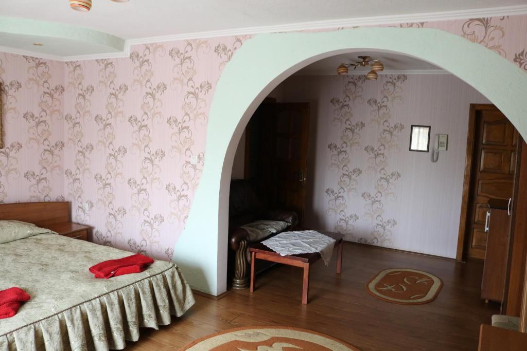 Postel nebo postele na pokoji v ubytování Готель ***ФЕЄРІЯ
