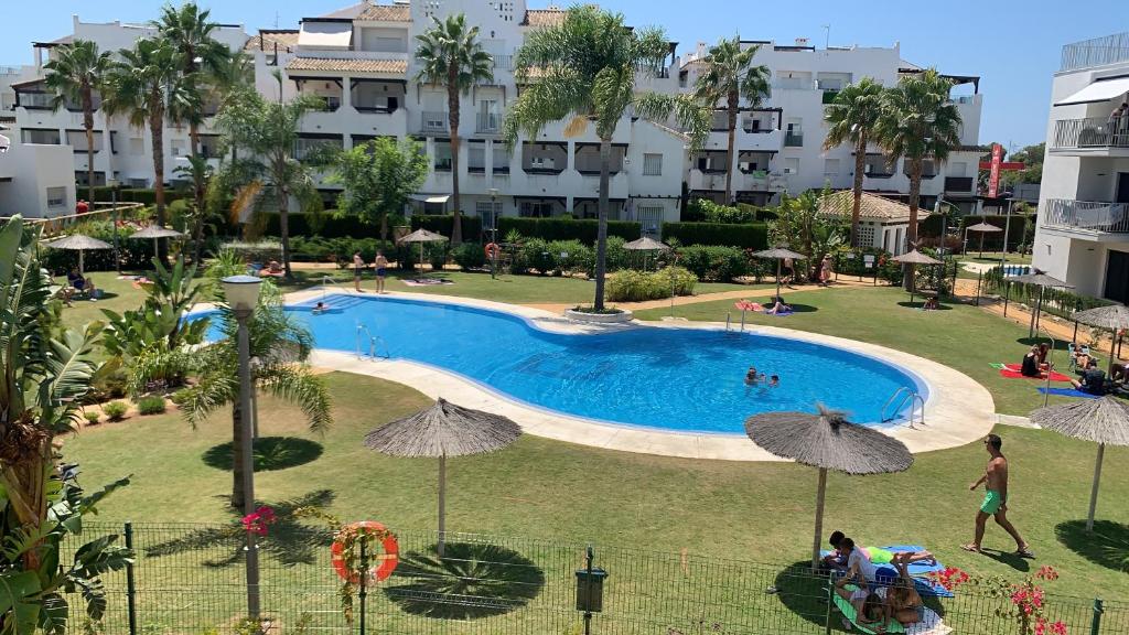 a view of a swimming pool in a resort at Apartamento La Sirenita in Rota