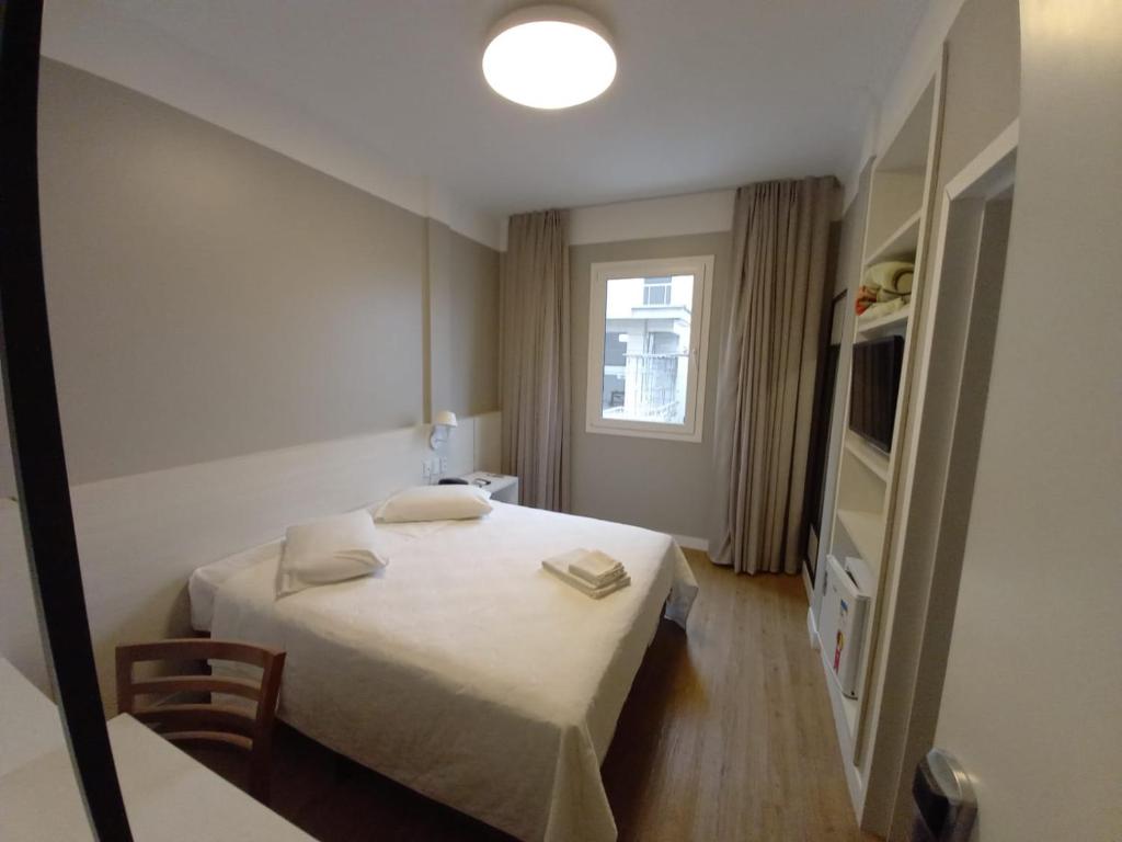 Postel nebo postele na pokoji v ubytování Hotel Emacite Flex