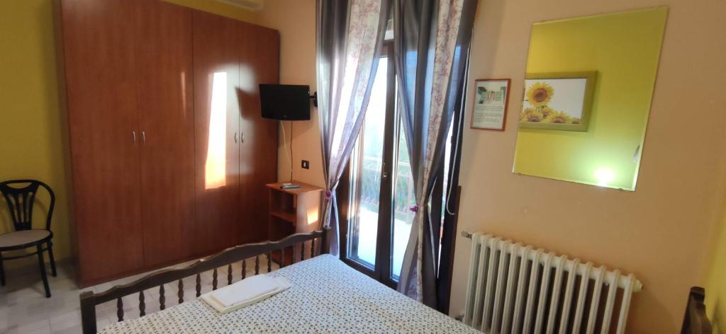 Postel nebo postele na pokoji v ubytování Complesso turistico Aurora - camere B&B
