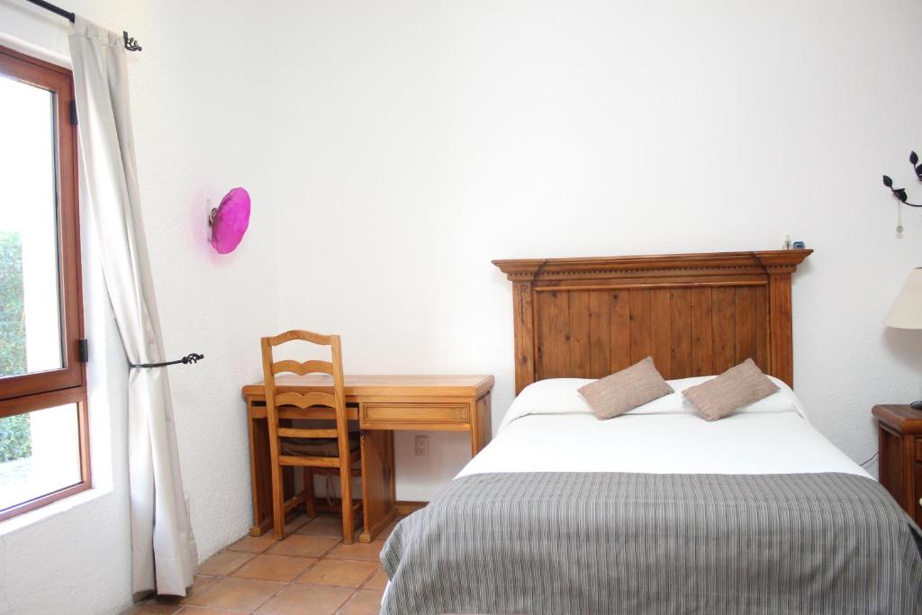 Postel nebo postele na pokoji v ubytování La Casona de los Colibríes