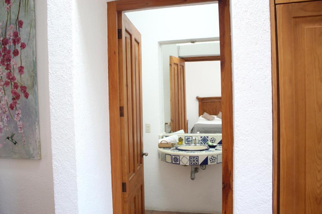 Postel nebo postele na pokoji v ubytování La Casona de los Colibríes