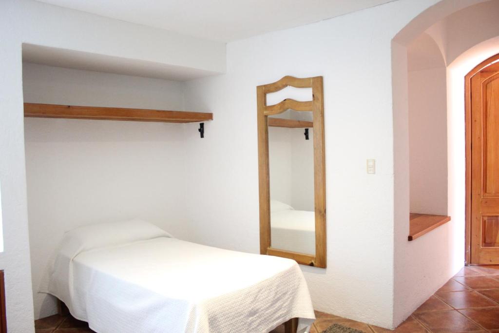Postel nebo postele na pokoji v ubytování La Casona de los Colibríes