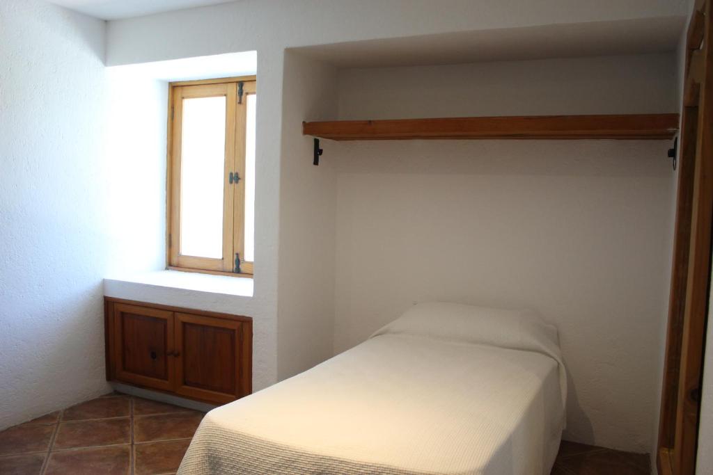 Postel nebo postele na pokoji v ubytování La Casona de los Colibríes