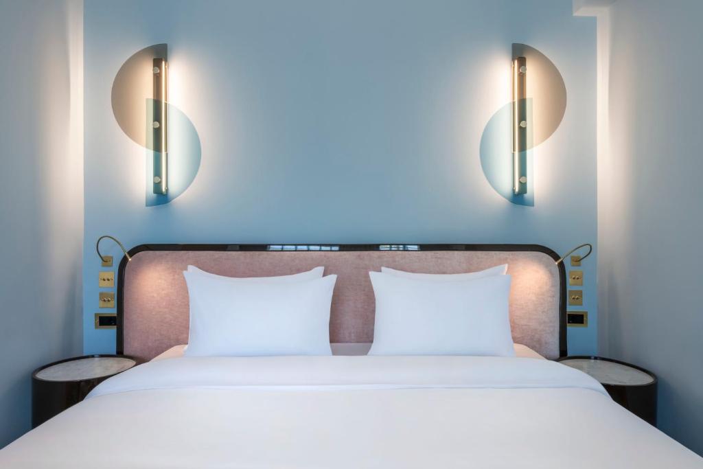 Postel nebo postele na pokoji v ubytování Bazzar Boutique Hotel