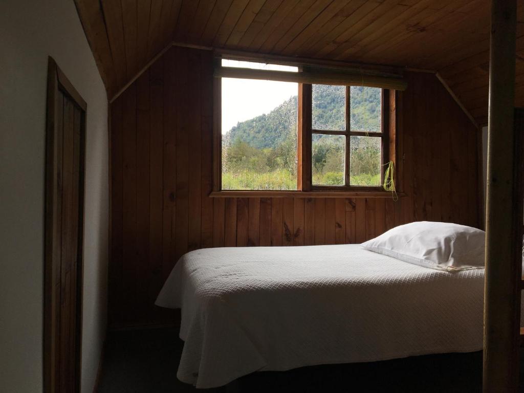 Postel nebo postele na pokoji v ubytování Bosque Patagonico Cabañas y Camping