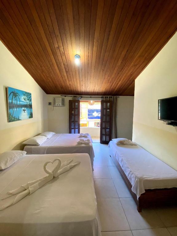 Postel nebo postele na pokoji v ubytování FLATS VASCONCELOS