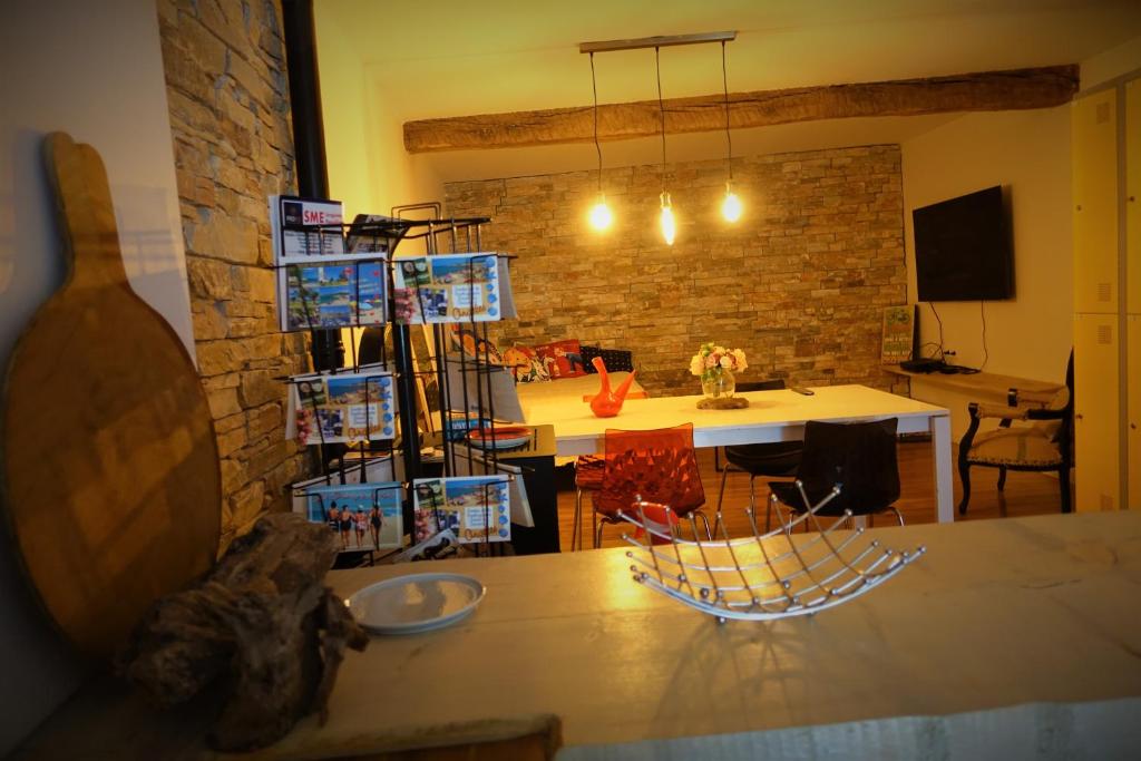 a living room with a table and a dining room at Maison Small Luxury ( planxa,suite,solarium,jacuzzi,pas de vis à vis) in Argelès-sur-Mer